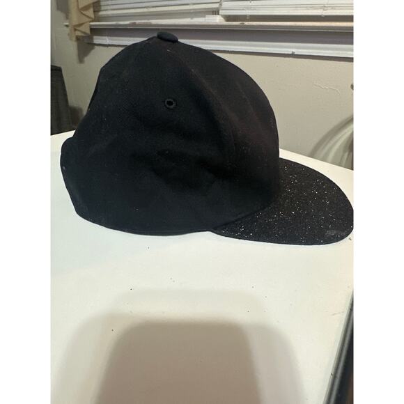 This is a Pit Bull Pukka black snapback hat with a glitter brim. Wore once - Picture 2 of 6
